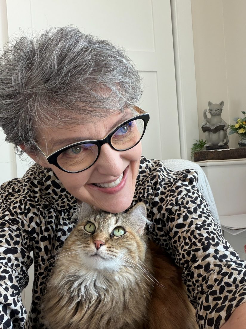 Alora and Ginger the cat posing together for a selfie