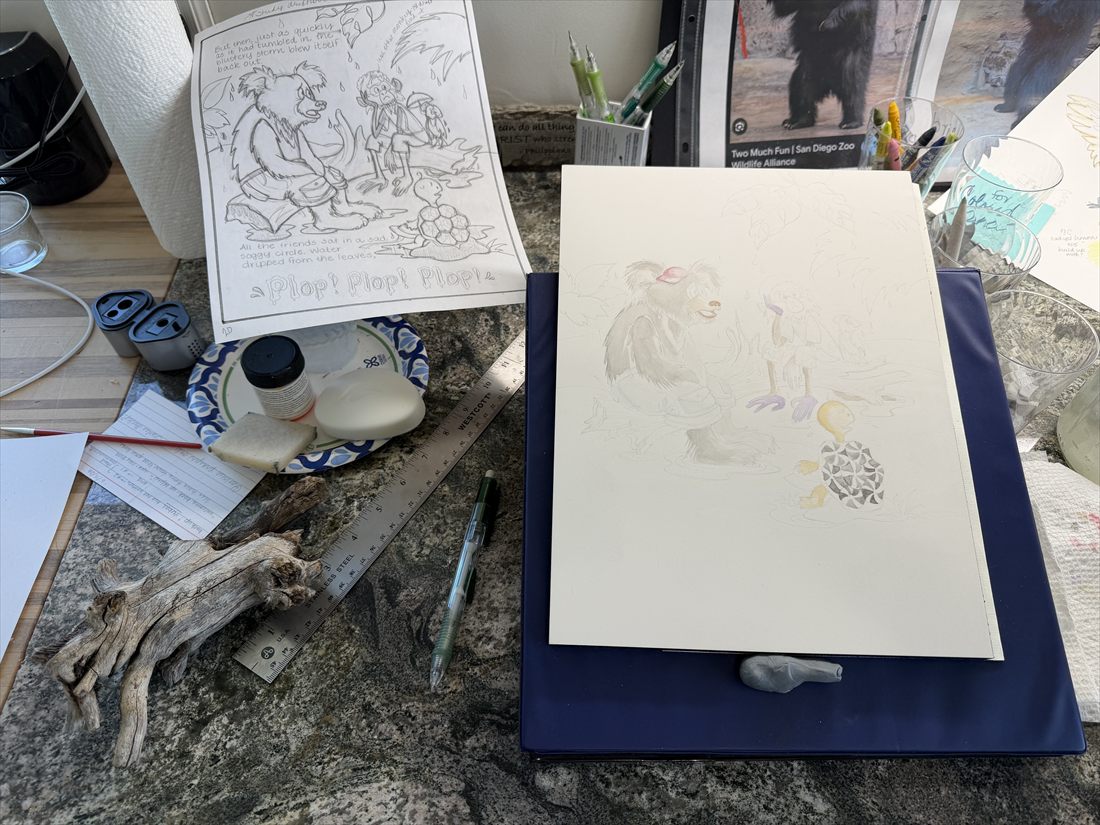 A page with its first pale washes of watercolor, next to the pencil sketch and a piece of driftwood